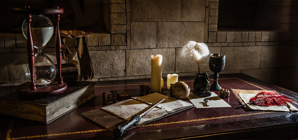 A desk covered in magical objects and notes