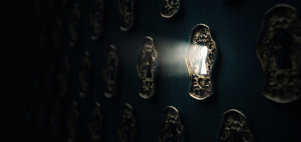 A keyhole with light shining through it